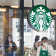 Exterior shot of Starbucks window with customers inside